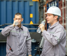 Construction workers drink water